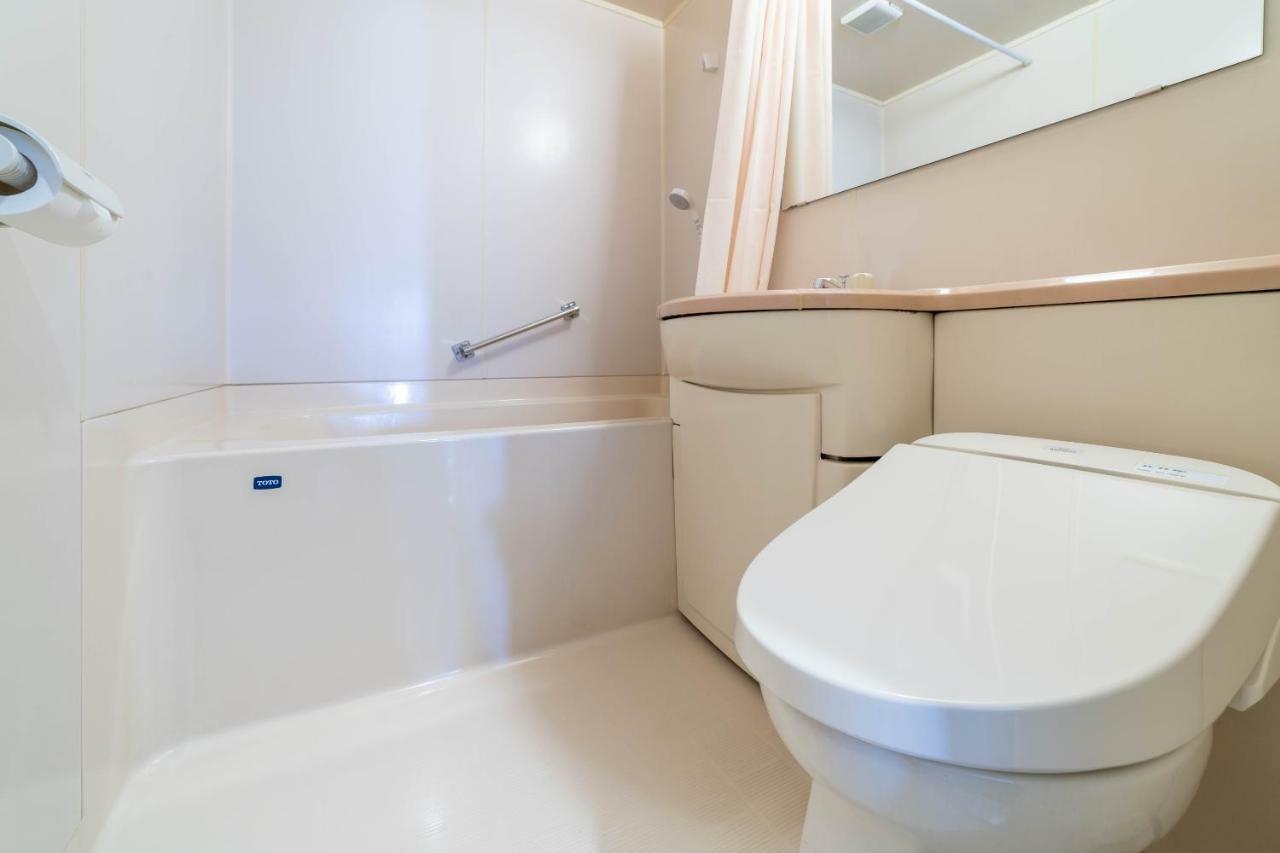 Oyo Business Hotel Nishiura Йоккаити Экстерьер фото
